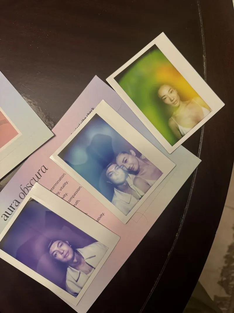 aura obscura keepsake cards and portraits laid out at an event