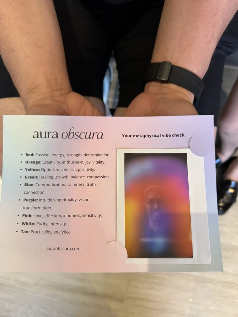 hands holding the aura interpretation guide